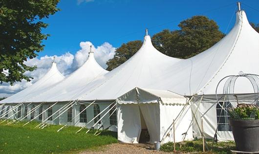 a line of sleek and modern porta potties ready for use at an upscale corporate event in River Oaks